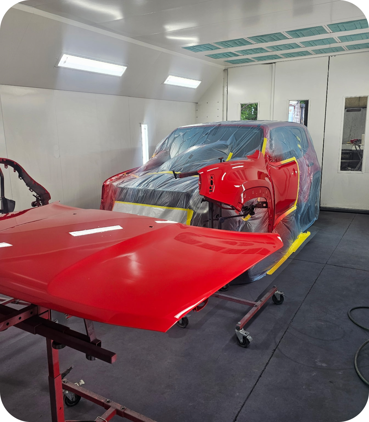 Car hood and body in paint booth